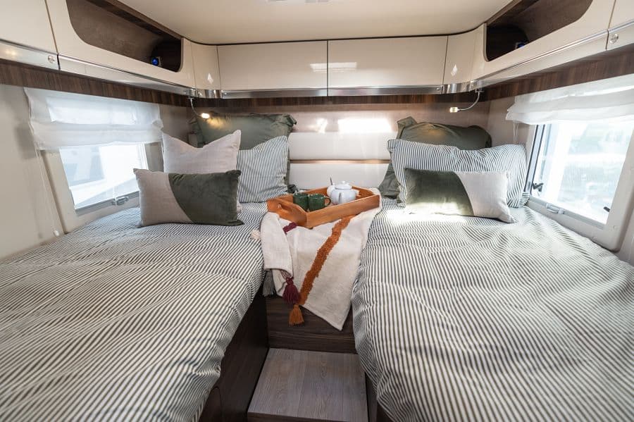 4-berth campervan twin bed configuration with breakfast tray between beds