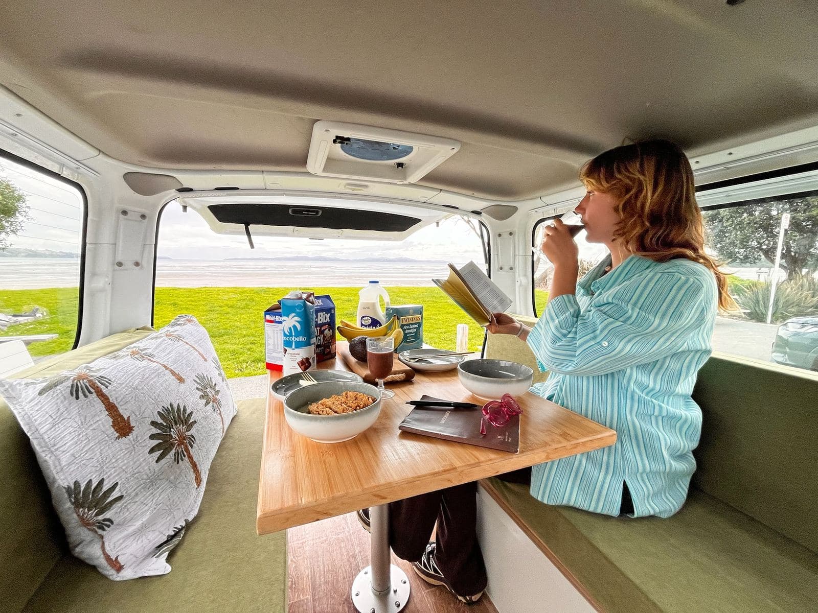 The Pīwakawaka in its day layout: both bench seats and the table up for breakfast