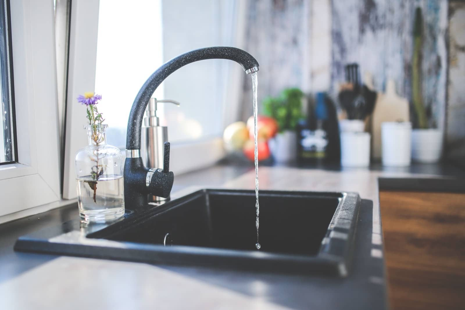 Running water from a modern kitchen tap, safe to drink across most of New Zealand