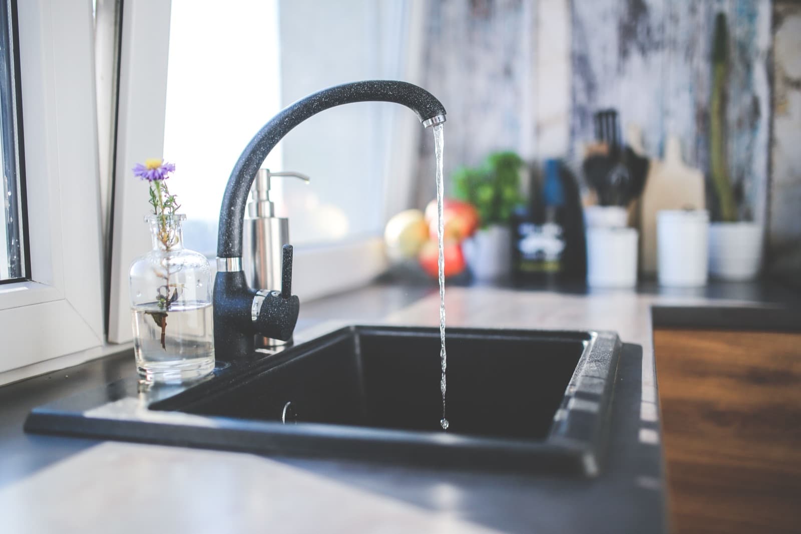 Running water from a modern kitchen tap, safe to drink across most of New Zealand