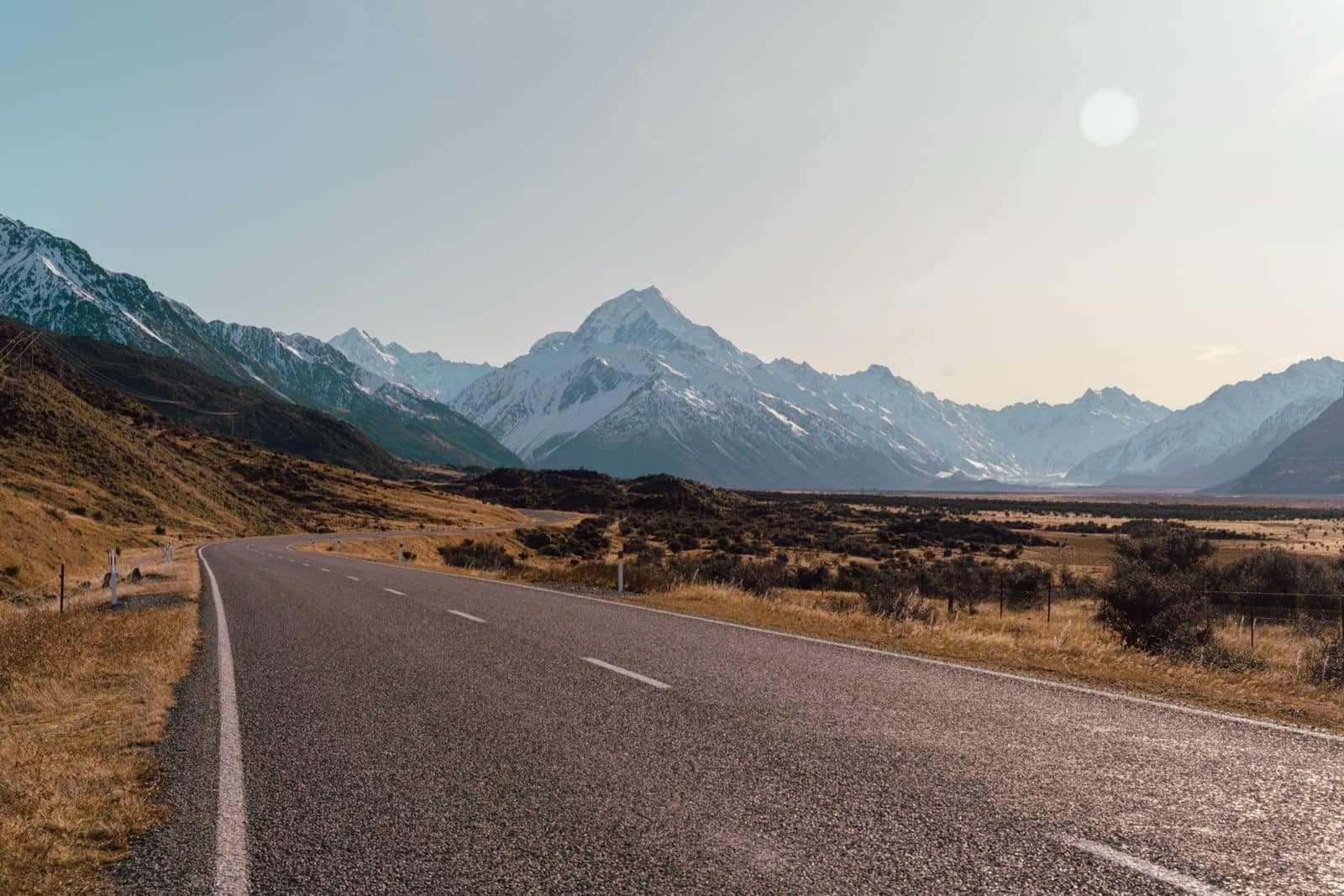 Open road leading toward Aoraki Mount Cook on a two-week New Zealand campervan itinerary