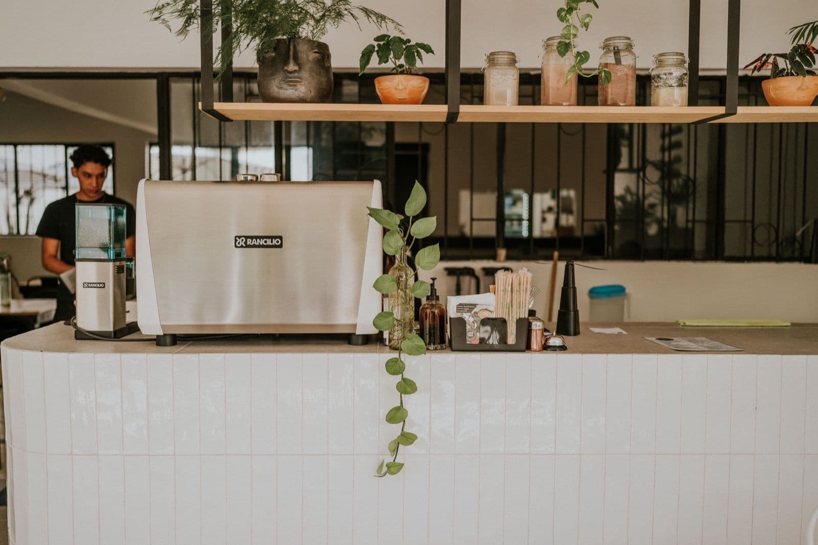 Cafe counter with an espresso machine, the kind of New Zealand cafe where tipping questions come up